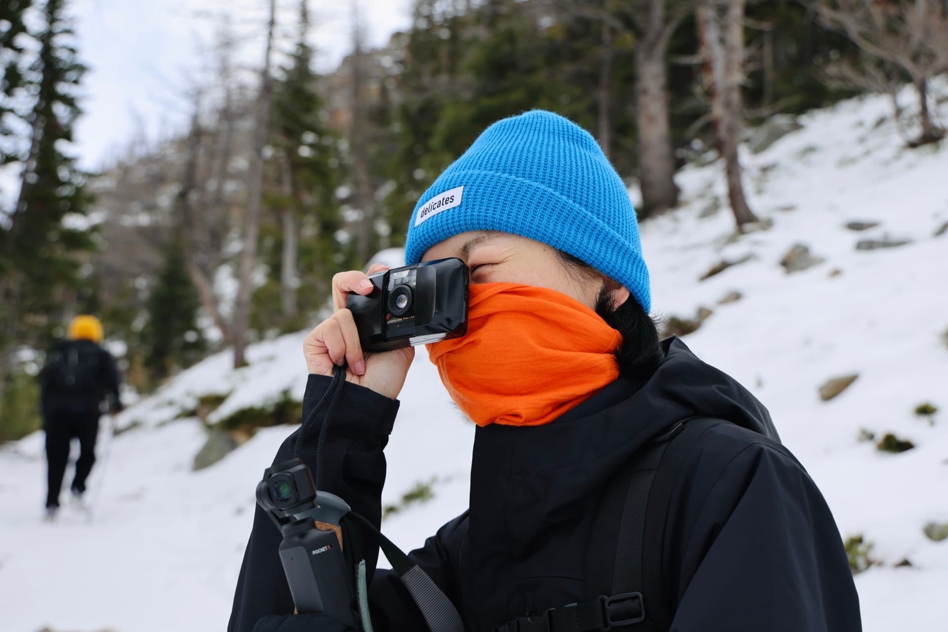 Film camera and snowy mountains